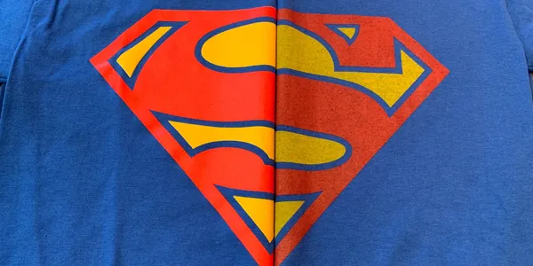 Close-up of vibrant ink printed over a white underbase on a dark custom t-shirt by Island Silkscreen in Northport, NY.