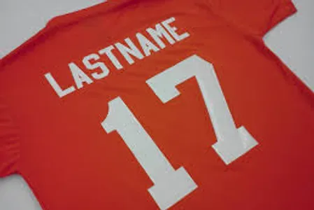 Close-up of athletic-grade custom vinyl numbers heat-pressed onto a sports jersey by Island Silkscreen in Northport, NY.